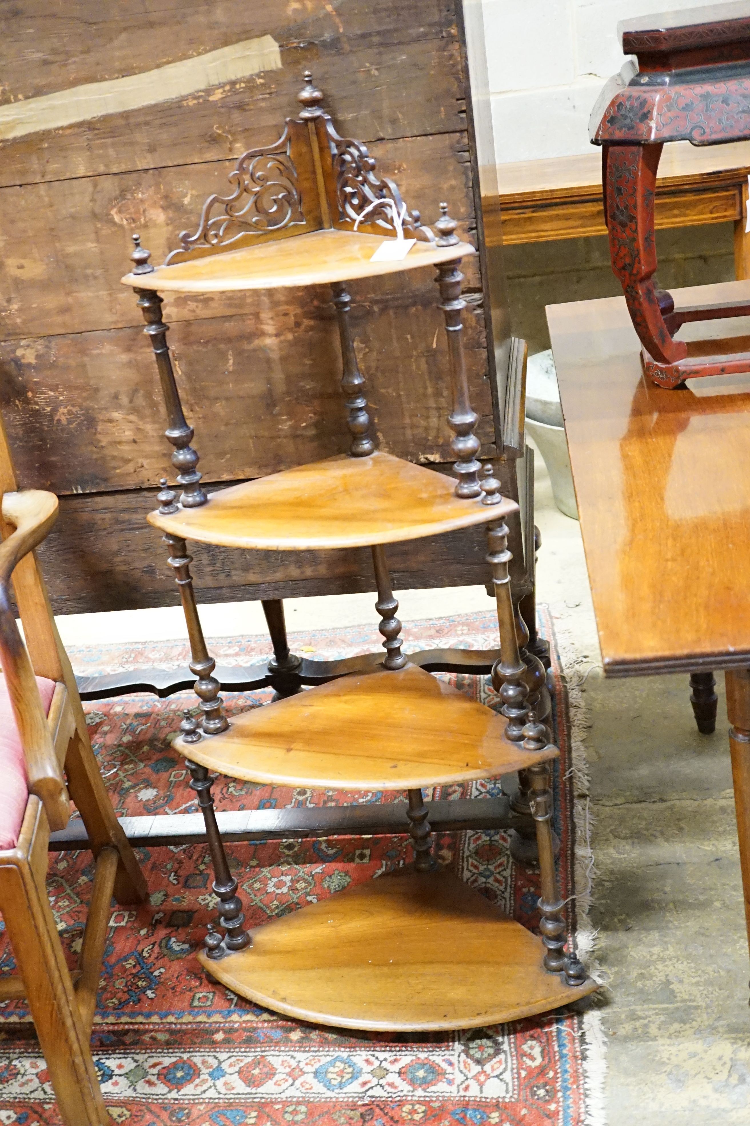 A late Victorian walnut four tier corner whatnot, height 116cm